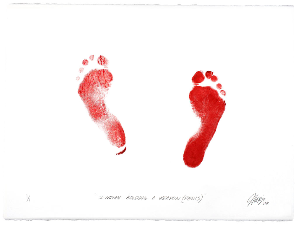 On creamwhite paper, in bright red ink, the print of bare feet, the left less defined than the right. Both footprints show five toes, and both feet are splayed outward, the left slightly moreso than the right, and slightly forward. Beneath, blackinked in oblique print hand, "INDIAN HOLDING A WEAPON (PENIS), and in the bottom right corner, in oblique script, "J Harjo 2018", the date in subscript. 