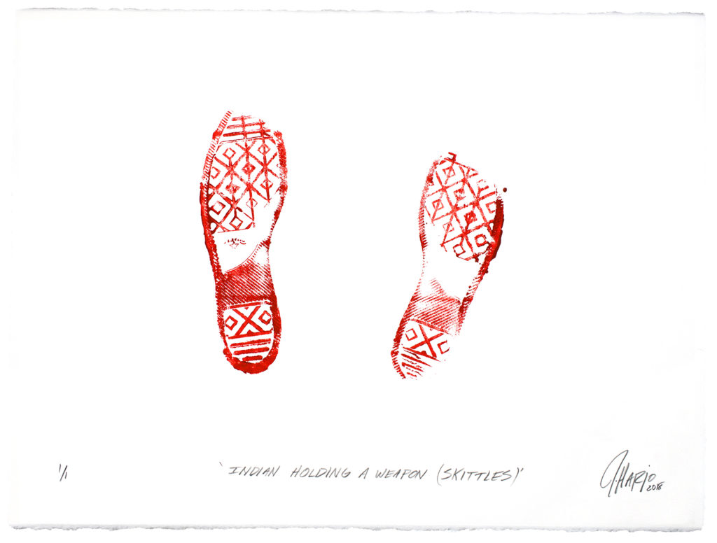 On creamwhite paper, in brightred ink, the imprint of footwear with a complex tread, made up of voided lozenges under the sole and heel, horizontal bars at the toe and end of the heel, and an oblique block under the arch beginning at the heel and ascending to the instep halfway up. Vertical bars transverse the voided lozenges along the sole, bisecting them. Both feet are splayed slightly outward, that on the left only barely, and slightly ahead. The inner tip of the toe of the left foot has not made contact with the paper, nor have the toe and the outer edge of the heel of the right. Beneath, in blackinked oblique print hand, "INDIAN HOLDING A WEAPON (SKITTLES)", and in the bottom right corner, the cursive signature J Harjo 2018", where the data is in subscript. 