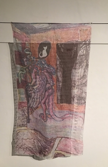 On two black cords, before a pale wall, hang sheets of sheer cloth or transparent paper. The front hanging is marked with an image: before a brick red wall, an incarnadine humanoid figure stoops toward a vermillion barred rectangular portal. The figure has a tail, feathered arms, clawed feet and hands, and serpents, feathers or fur, and blebs or pustules upon its back and head. The figure walks with a black cane or walker. In the red wall, above the figure in a round black niche, sits a white cat, facing away. In a larger rectangular cavity to the right, a dark tree is visible upon a lighter void. The figure stands upon light lavender ground; before which proceed rectangles of black and pink, framed with white lanes. On the back hanging, there is hand printed text, largely illegible. 